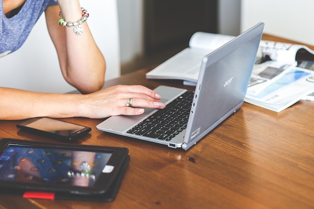 Woman Searching on Laptop